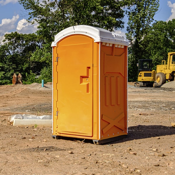 what is the cost difference between standard and deluxe portable toilet rentals in Orchard Hill